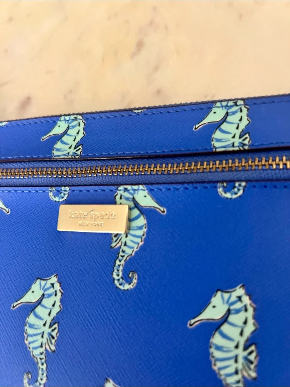 kate spade cobalt blue seahorse wristlet clutch